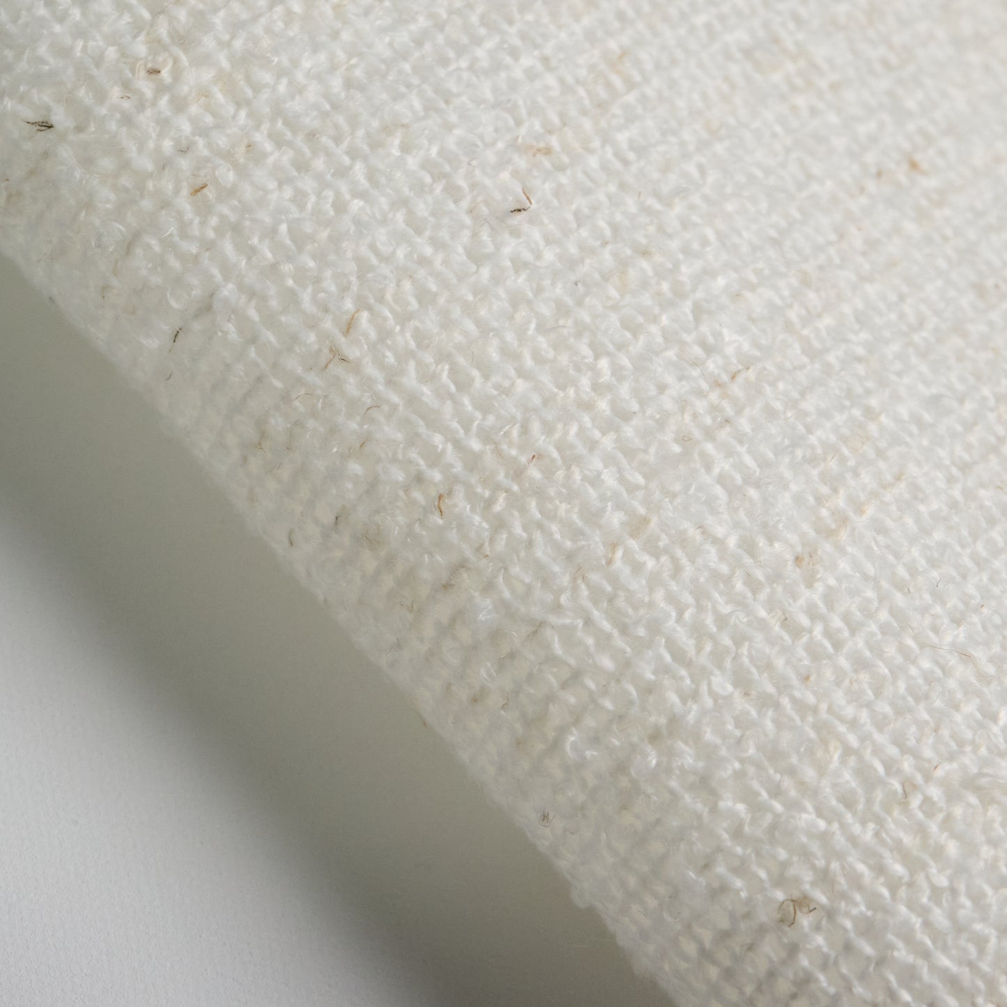 Close-up of BOUCLE fabric in off-white color, showing texture and composition for textile applications.