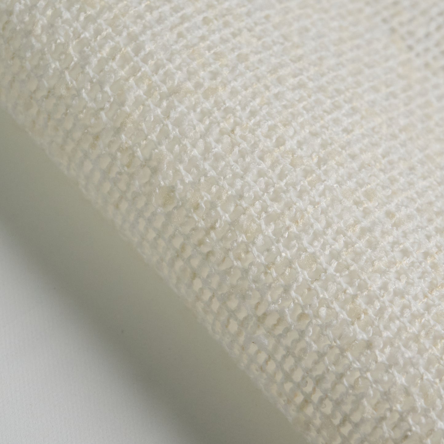 BOUCLE fabric close-up in white color, showcasing texture and weave detail for interior design projects.