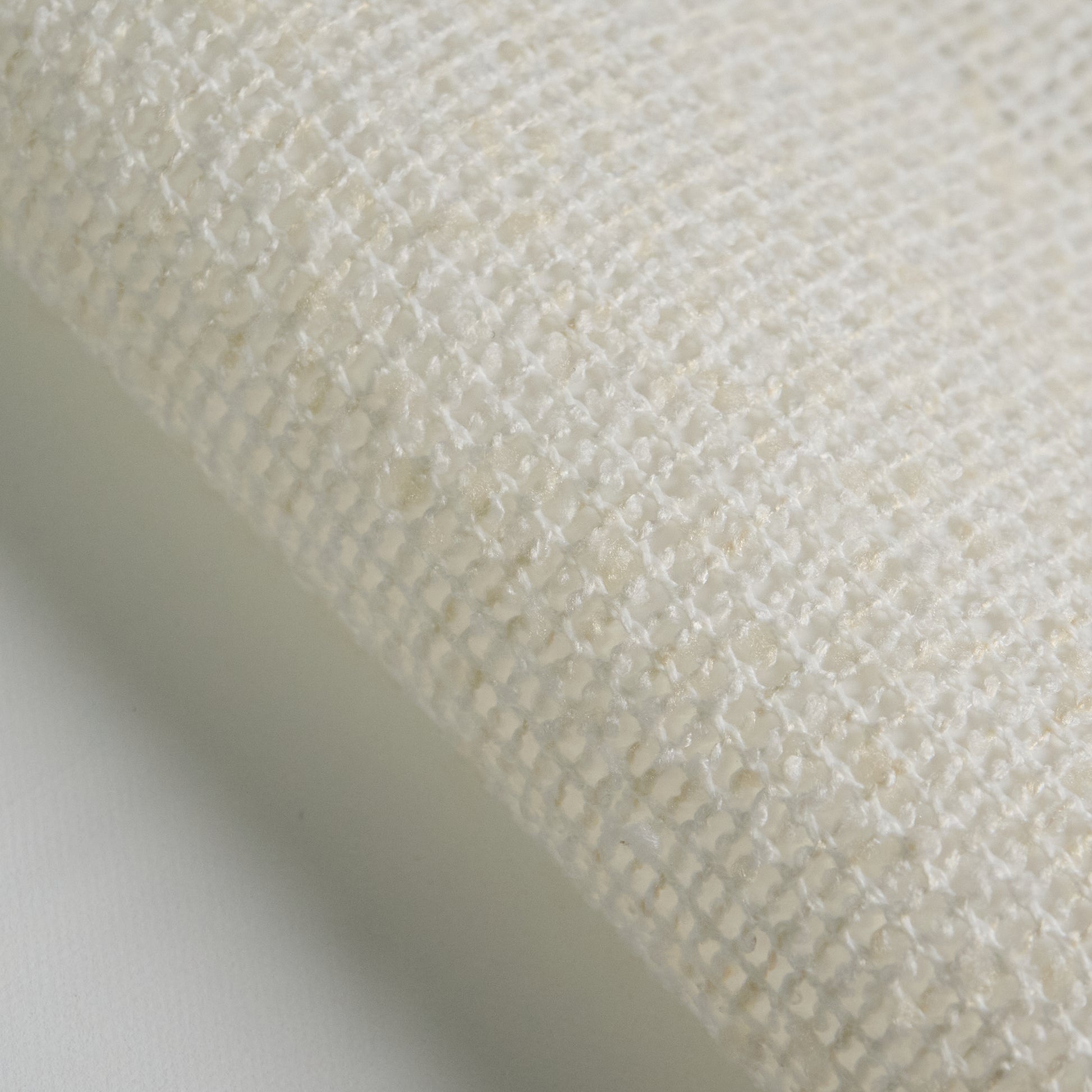 BOUCLE fabric close-up in white color, showcasing texture and weave detail for interior design projects.