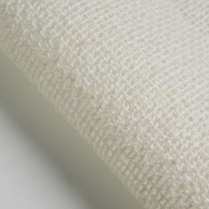 BOUCLE fabric close-up in white color, showcasing texture and weave detail for interior design projects.