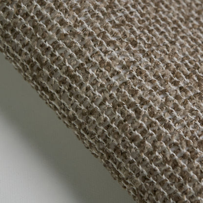 Close-up of BOUCLE fabric texture, showcasing its woven pattern and wool-like appearance in neutral tones.